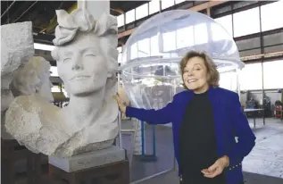  ??  ?? ALAMEDA, California: In this Dec 19, 2016 photo, Dr Sylvia Earle stands beside a carved bust of herself at Deep Ocean Exploratio­n and Research Marine Center. — AP
