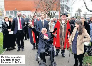  ??  ?? Mr Riley enjoys his new right to draw his sword in Salford