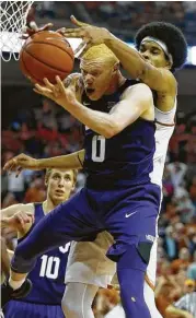  ?? Kin Man Hui / San Antonio Express-News ?? TCU’s Jaylen Fisher, left, makes sure Texas’ Jarrett Allen has no chance at grabbing the rebound.