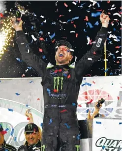  ?? AP PHOTO/TIMOTHY D. EASLEY ?? Kurt Busch celebrates his win in the NASCAR Cup Series race Saturday night at Kentucky Speedway in Sparta, Ky.