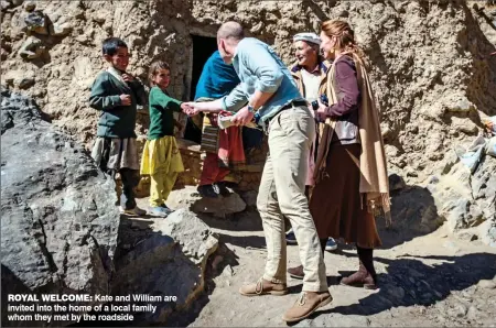  ??  ?? ROYAL WELCOME: Kate and William are invited into the home of a local family whom they met by the roadside