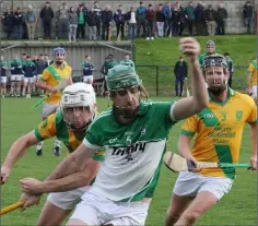 ??  ?? Barry Kehoe (Cloughbawn) breaking away from Harry Goff and Anthony Wallace (Shamrocks) in The Courtyard Ferns IHC quarter-final.