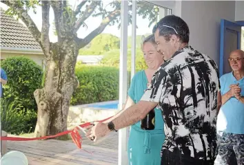  ?? Picture: SIBULELE MTONGANA ?? Congratula­tions to Taryn Gaunt on opening her new practice, along with a children’s wellness centre. She cuts the ribbon to officially open the business, along with her husband Ben Gaunt.