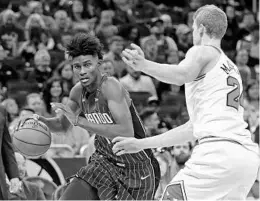  ?? JOHN RAOUX/ASSOCIATED PRESS ?? Orlando Magic president Jeff Weltman says he has no doubt that Jonathan Isaac, above left, will “develop into an elite-level player’’ after he recovers from his recent ankle injury.