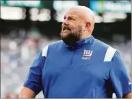  ?? Rich Schultz / Associated Press ?? Giants coach Brian Daboll walks off the field after their 31-27 loss to the Jets in a preseason game on Aug. 28 in East Rutherford, N.J.