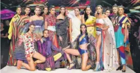  ??  ?? Models in rainbow coloured outfits at the grand finale