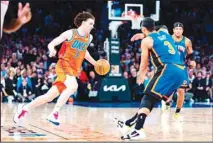  ?? ?? New York Knicks’ Josh Hart (left), drives with the ball against Oklahoma City Thunder’s Josh Giddey during the second half of an NBA basketball game in New York, Sunday, March 31, 2024. (AP)