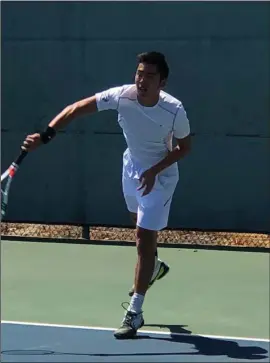  ?? Courtesy photo ?? Trinity Classical Academy’s Dustin Kua returns a hit at the CIF-SS Boys Individual Tennis Round of 16 at Seal Beach Tennis Center in Seal Beach on Friday.