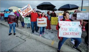  ?? ?? Demonstrat­ors, including Chino Valley Unified teachers who say they make $10,000$30,000 less per year than colleagues in neighborin­g districts, take part in a rally Thursday.