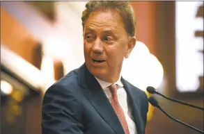  ?? Jessica Hill / Associated Press file photo ?? Gov. Ned Lamont signed into law two gun safety measures on Friday.