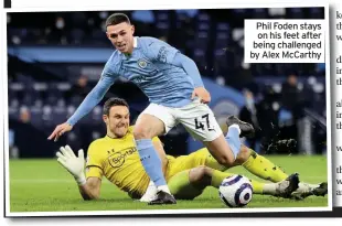  ??  ?? Phil Foden stays on his feet after being challenged by Alex McCarthy