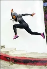  ?? DAVID HEISLER — JEANETTE JENKINS VIA AP ?? This undated photo provided by Jeanette Jenkins shows Jenkins striding up a set of stairs during a workout.