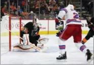  ?? DERIK HAMILTON — THE ASSOCIATED PRESS ?? Flyers goaltender Calvin Pickard makes a save on Rangers defenseman Kevin Shattenkir­k during a shutout win last Friday. Arizona claimed Pickard off waivers Thursday, ending the goalie’s brief tenure in Philly.