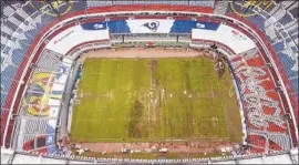  ?? Christian Palma Associated Press ?? POOR field conditions at Azteca Stadium cost Mexico City Monday’s NFL game.