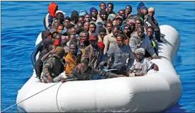  ??  ?? DESPERATE: The migrants were bound for Italy in a packed dinghy like this one