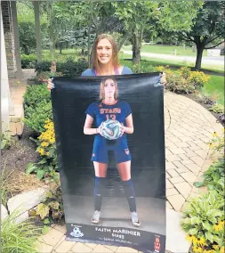  ?? ROBIN ALAM/PEPSICO SHOWDOWN ?? Recent Stagg graduate Faith Mariner shows off a near-life-size poster of herself that was made as a part of the PepsiCo Showdown event.