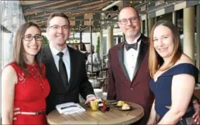  ??  ?? Jessica Tayler, of Wynnewood, and husband Ezekiel, a critical care physician, share a spot on the dock with cardiac surgeon Matthew Thomas, also of Wynnewood, and his wife, Gina.