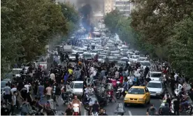  ?? Photograph: EPA ?? Protesters flooding a street in Tehran.