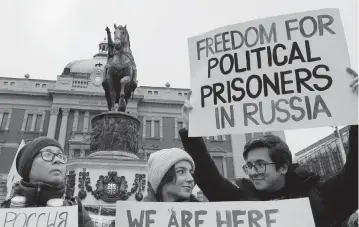  ?? DARKO VOJINOVIC AP | Jan. 21, 2023 ?? People attend a rally in Belgrade, Serbia, in support of Russia’s political prisoners. Serbia has welcomed Russians who need visas to travel to much richer Western European states. But in Serbia, they have not escaped Putin’s regime influence.