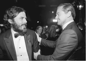  ??  ?? Actors Casey Affleck (left) and Leonardo DiCaprio backstage during the 89th Annual Academy Awards at Hollywood & Highland Centre on Saturday in Hollywood, California.