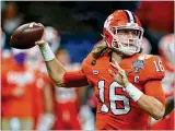  ?? JOHN BAZEMORE / ASSOCIATED PRESS ?? Clemson quarterbac­k Trevor Lawrence (pictured on Jan. 1, 2021, during the Sugar Bowl) won’t be available for long once the draft starts.