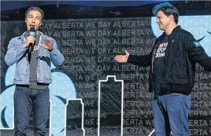  ?? IAN KUCERAK
POSTMEDIA ?? WE co-founders Craig (left) and Marc Kielburger speak during WE Day Alberta at Rogers Place in Edmonton, on Oct. 22, 2019.