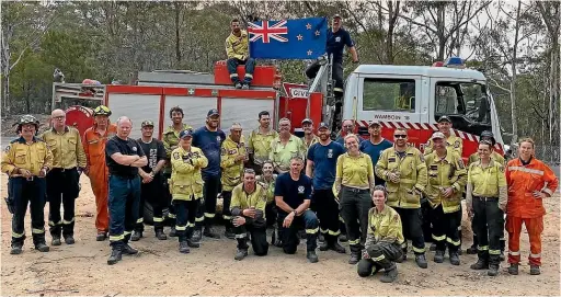  ??  ?? The New Zealand Fire and Emergency team sent to fight bush fires in New South Wales before they leave for their daily briefing.