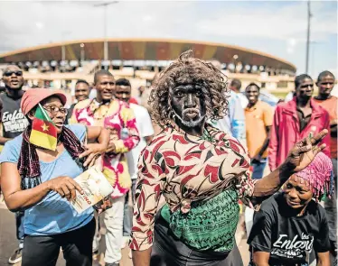  ?? Picture: AFP ?? SERIOUS MANOEUVRES: A performer entertains the crowd at a rally in support of the leader of the Cameroonia­n opposition party Movement for the Rebirth of Cameroon, in Yaounde, before Sunday’s presidenti­al election