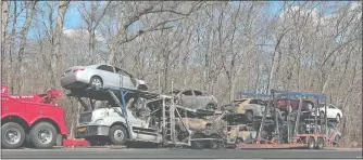  ?? DANA JENSEN/THE DAY ?? A tractor trailer car carrier caught fire Sunday on Interstate 95 south at Exit 70 in Old Lyme. The highway was closed for several hours.