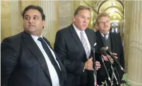  ?? MICHAEL MATHES/Getty Images ?? U.S. House Intelligen­ce Committee chairman Mike Rogers, centre, addresses reporters on Monday in Washington, D.C. after meetings with European Parliament members, including Britain’s Claude Moraes, left, who leads the parliament­ary inquiry on mass...