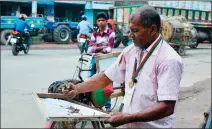  ?? REDWAN AHMED / AFP ?? Ohid Sarder, 53, counts steel nails that he removed from a tree trunk near a road in Jessore, Bangladesh, on Oct 13.