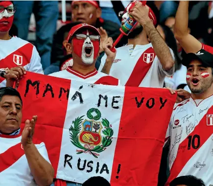  ?? PHOTO: REUTERS ?? Pervuian fans seem confident their team will reach the World Cup finals. The text on this man’s flag reads ‘‘Mum, I’m going to Russia.’’