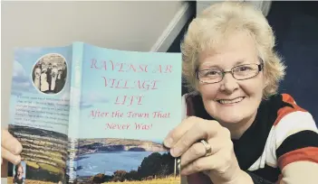  ??  ?? Eileen Beaumont with her book about Ravenscar