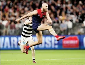  ?? Photo: Richard Wainwright/AAP image ?? Demon big man Max Gawn helped his side demolish the ageing Cats on Friday night with five goals.