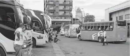  ??  ?? By next week or so, the Cebu South Bus Terminal is expected to be flooded with passengers wanting to go home to celebrate Christmas and New Year with their families. CLARK Y. PANUGALINO­G, USJ-R INTERN