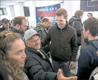  ?? Antonella Crescimben­i/Post-Gazette ?? Democratic candidate Conor Lamb greets supporters during a rally with the United Mine Workers of America on Sunday at the Greene County Fairground­s in Waynesburg.