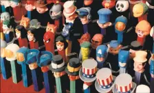  ?? Perry C. Riddle / Los Angeles Times ?? Like faces in the bleachers, Phyllis Schafer- Oreck's Pez dispenser collection forms a cartoon regiment.