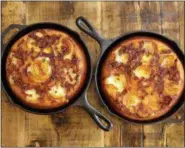  ?? RICHARD DREW — THE ASSOCIATED PRESS ?? This photo shows Vidalia onion cornbread baked in a cast iron skillet, styled by Sarah Abrams, at the Institute of Culinary Education in New York. This dish is from a recipe by Elizabeth Karmel.