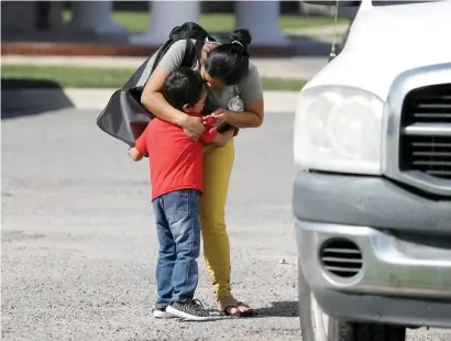  ?? Reuters ?? Anita Areli ramirez Mejia, an asylum seeker from honduras separated from her six year-old son Jenri near the Mexico-Us border, is reunited with him in harlingen, Texas. —