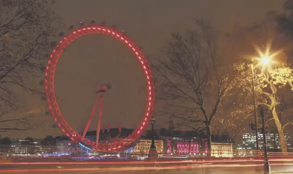  ??  ?? 0 The iconic London Eye landmark is lit up in red to mark a previous World Aids Day, which always falls on December 1