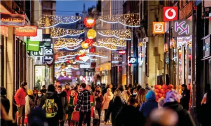  ?? Photograph: Robin Utrecht/REX/Shuttersto­ck ?? Christmas shopping in The Hague, Netherland­s, ahead of the country entering lockdown from Sunday due to a ‘fifth wave’ of Covid infections.