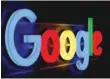  ?? — Reuters ?? An illuminate­d Google logo is seen inside an office building in Zurich.