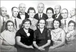  ?? IONE AND DOUGLAS WHITNEY VIA AP ?? Doug Whitney’s mother, Mildred Reiswig Whitney, back row fourth from left, stands with her siblings during a family reunion in 1959. Doug Whitney’s grandparen­ts had 14 children and 10 of them developed early-onset Alzheimer’s, including his mother.