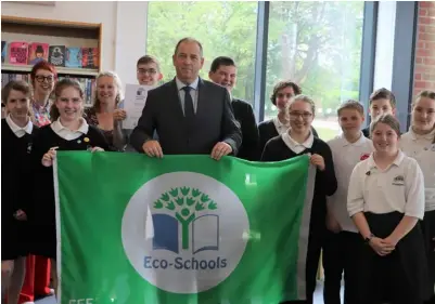  ?? Picture: Little Heath School ?? Little Heath School has been awarded Green Flag Accreditat­ion for its efforts to reduce its environmen­tal impact. Pictured are Head David Ramsden, centre, with pupils.