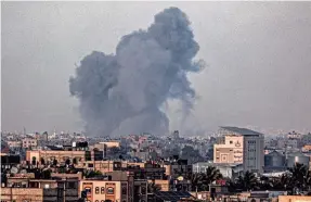  ?? AFP VIA GETTY IMAGES ?? A view from the southern Gaza Strip city of Rafah shows smoke from an Israeli bombardmen­t of nearby city of Khan Younis Thursday.