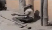  ?? — via web ?? A video grab shows a Nigerian tied to a post and being beaten up by a mob with sticks in New Delhi.