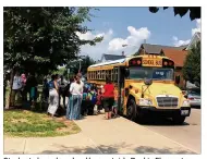  ?? JEREMY P. KELLEY / STAFF ?? Students board a school bus outside Ruskin Elementary school in Dayton in 2016 as teachers and school staff monitor the area.