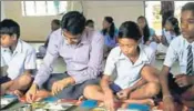  ?? HT ?? Sundargarh district collector Surendra Kumar Meena shares midday meal with students of a government school in Odisha.