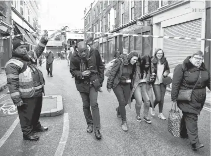  ?? REUTERS ?? People leave the area near Borough Market after an incident at London Bridge on Friday.