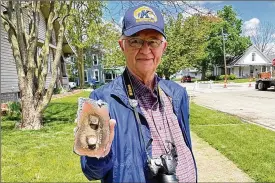  ?? CONTRIBUTE­D BY PAM COTTREL ?? Larry Allington holds a bolted section of the tower he saved for the First Presbyteri­an Church.